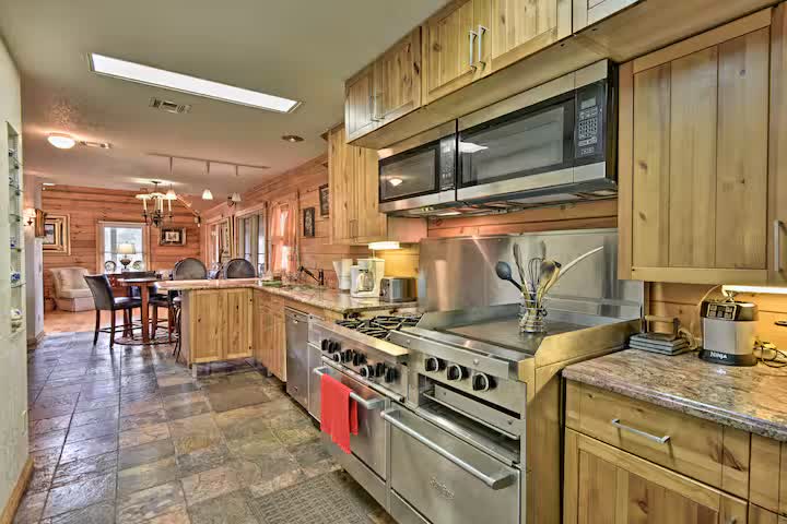 Spacious farmhouse kitchen with stainless steel range